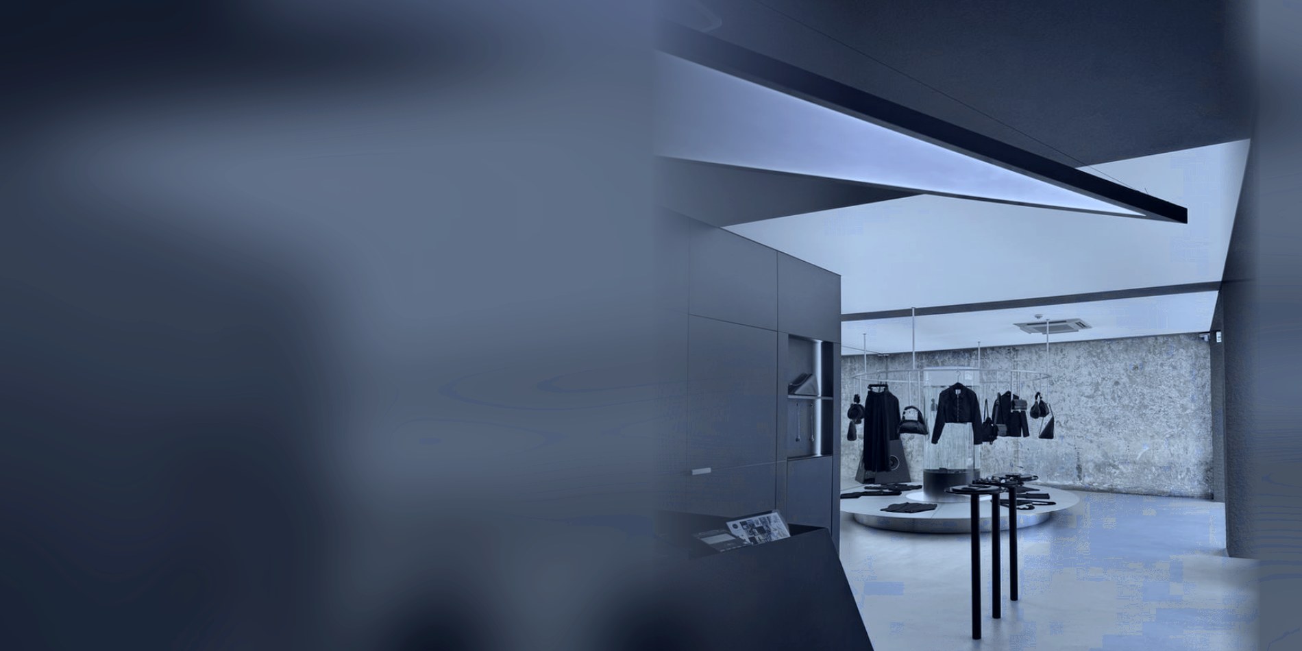 A minimal retail floor lit in cobalt with a central display, DTC growth for fashion brands