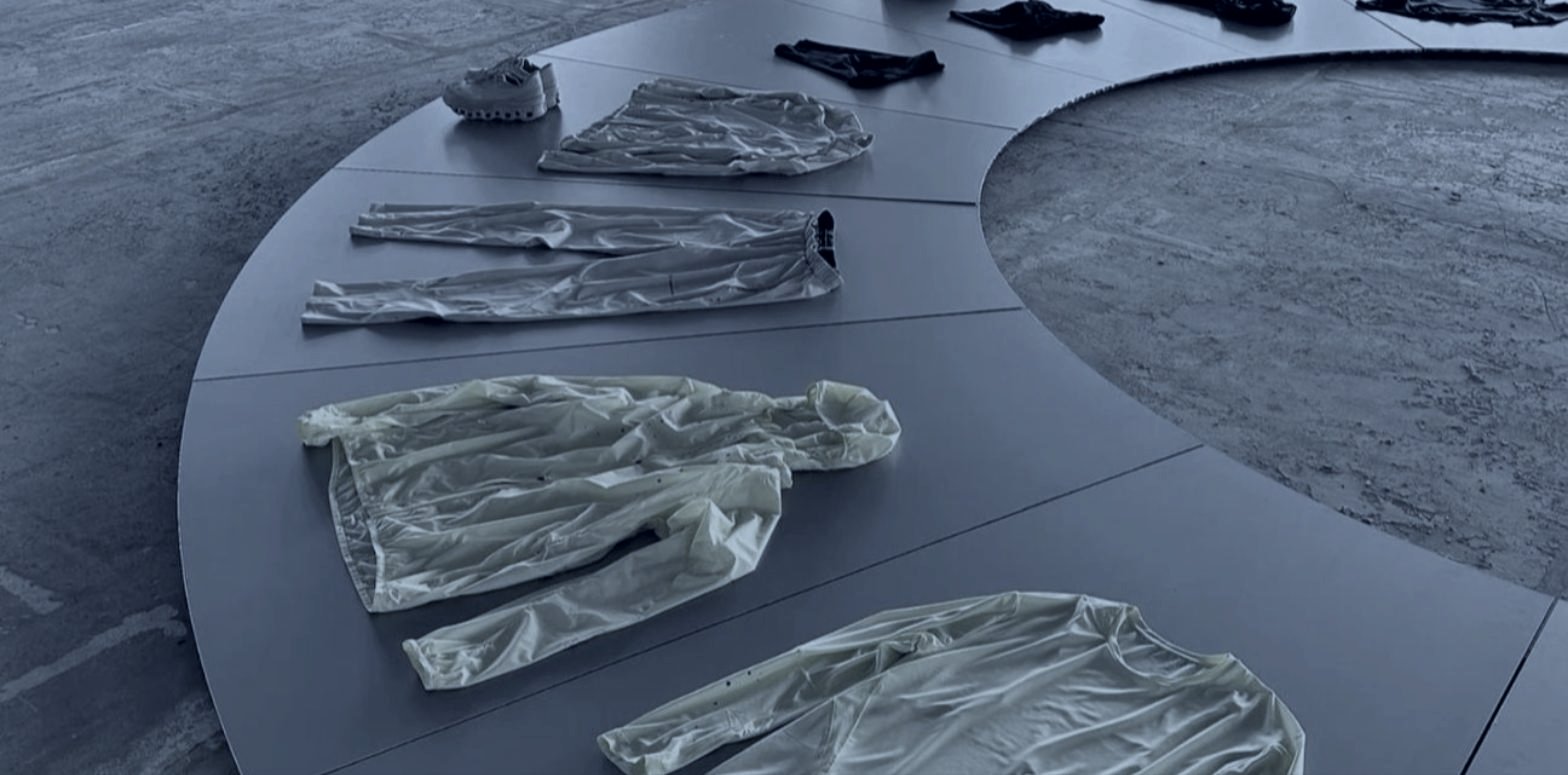 A collection laid out on a circular platform, international fashion pop ups by DE Agency