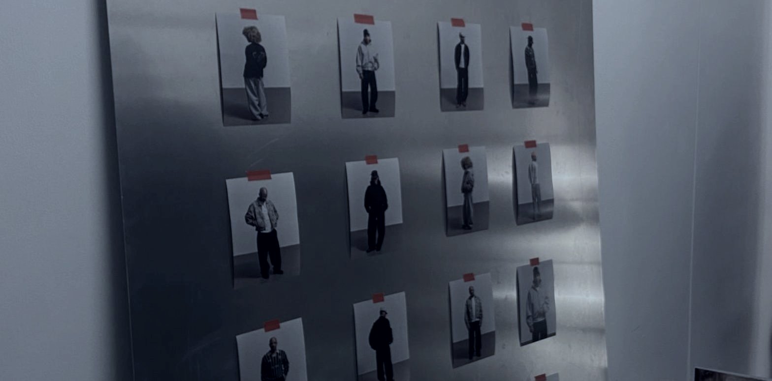 A collection pinned to a steel wall, fashion production from sample to season