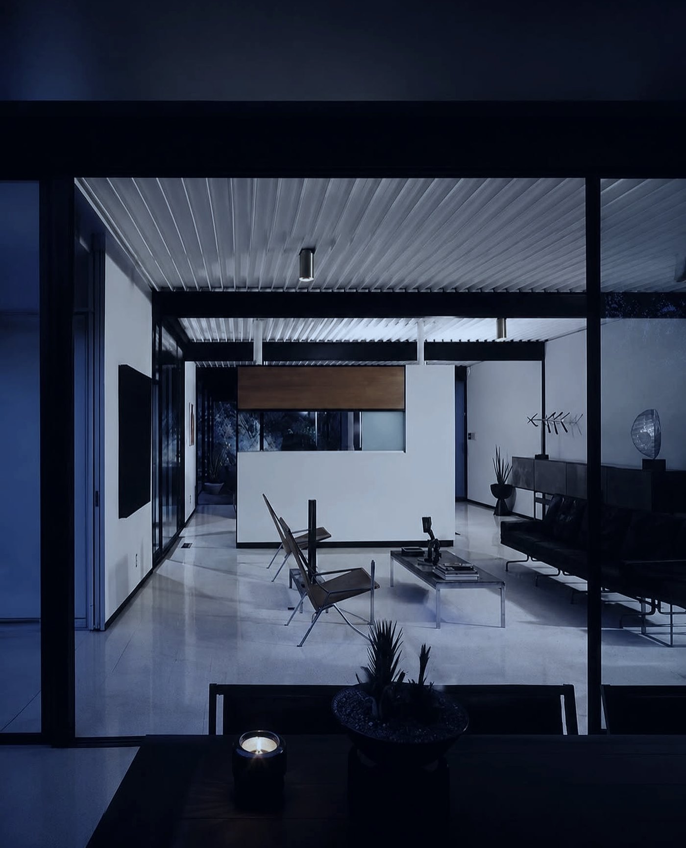 A modernist interior at dusk in blue light, where a Chinese customer first meets a fashion brand on RedNote
